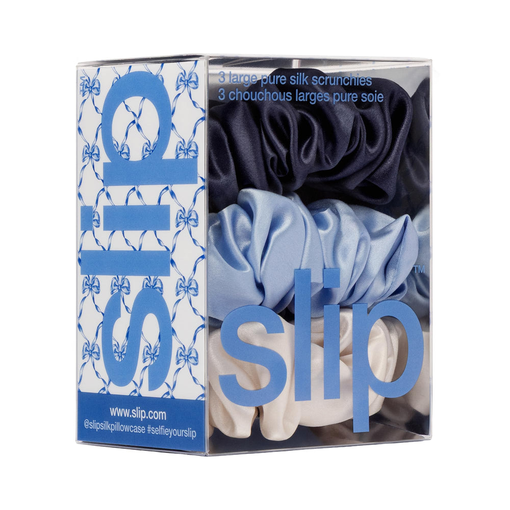 SLIP scrunchie next to coin showing large size and secure, lightweight hold