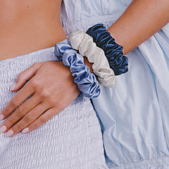 SLIP indigo scrunchie detail revealing elastic core and cushioned silk sleeve benefit