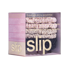 SLIP scrunchies in hand to show slim size and easy portability benefit