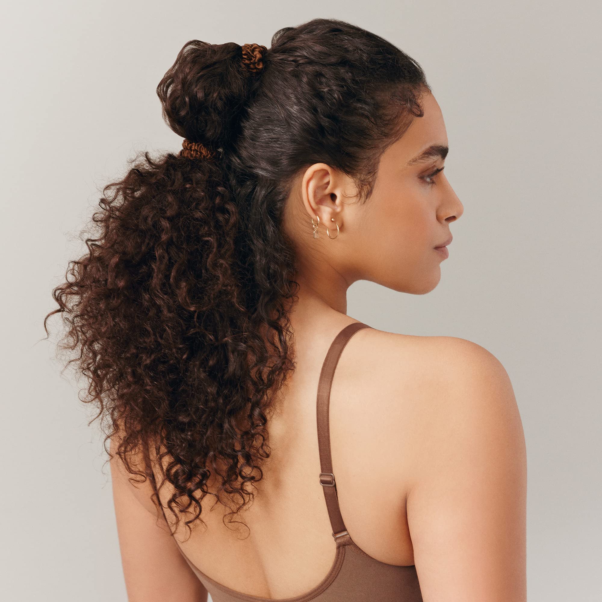 SLIP silk skinny wrapped in a bun highlighting secure hold with low bulk
