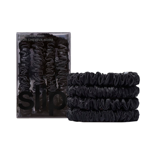 SLIP front packaging showing four black silk skinny scrunchies, elegant gift-ready