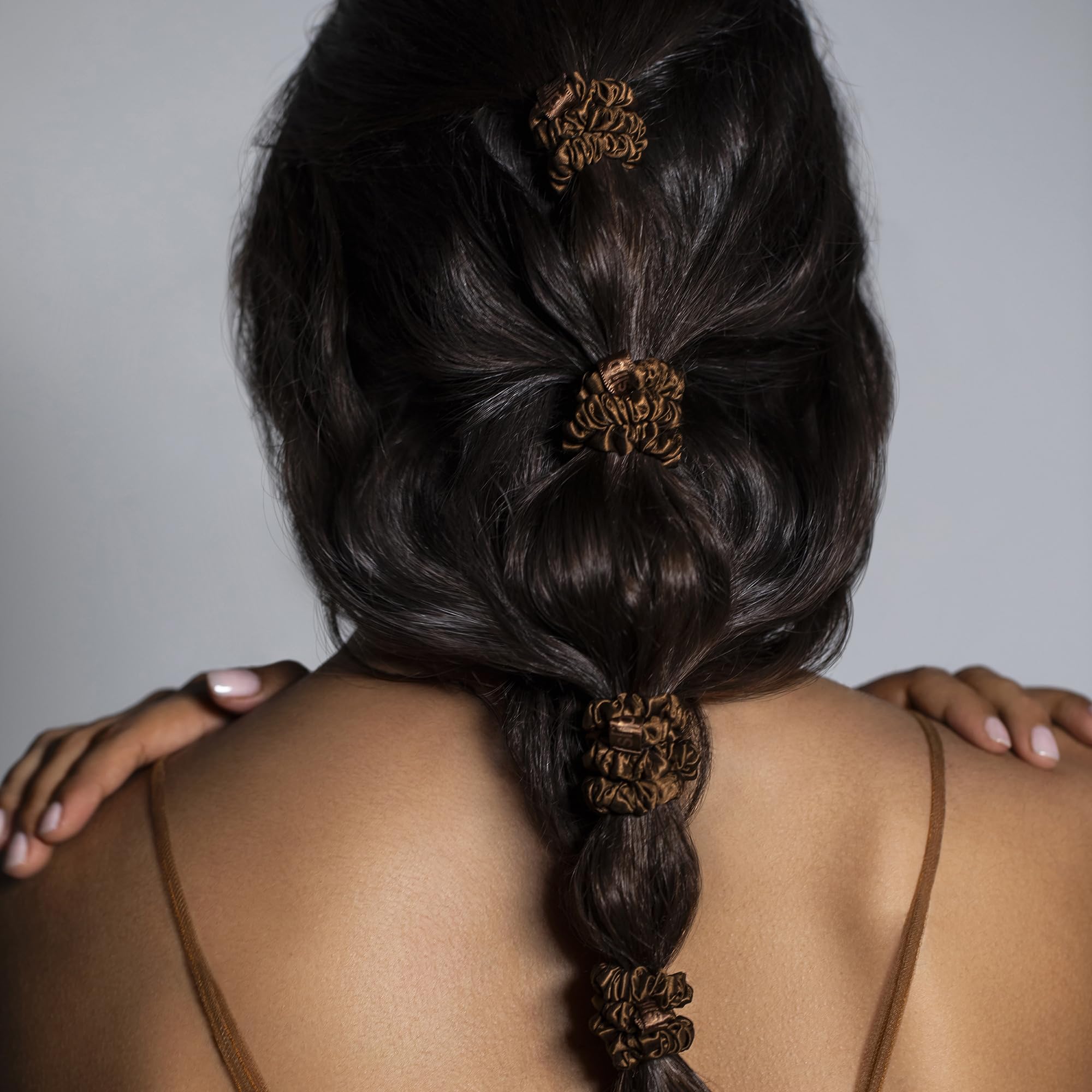 SLIP scrunchie on wrist showing slim size and gentle hold for convenience