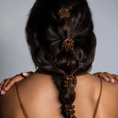 SLIP scrunchie on wrist showing slim size and gentle hold for convenience
