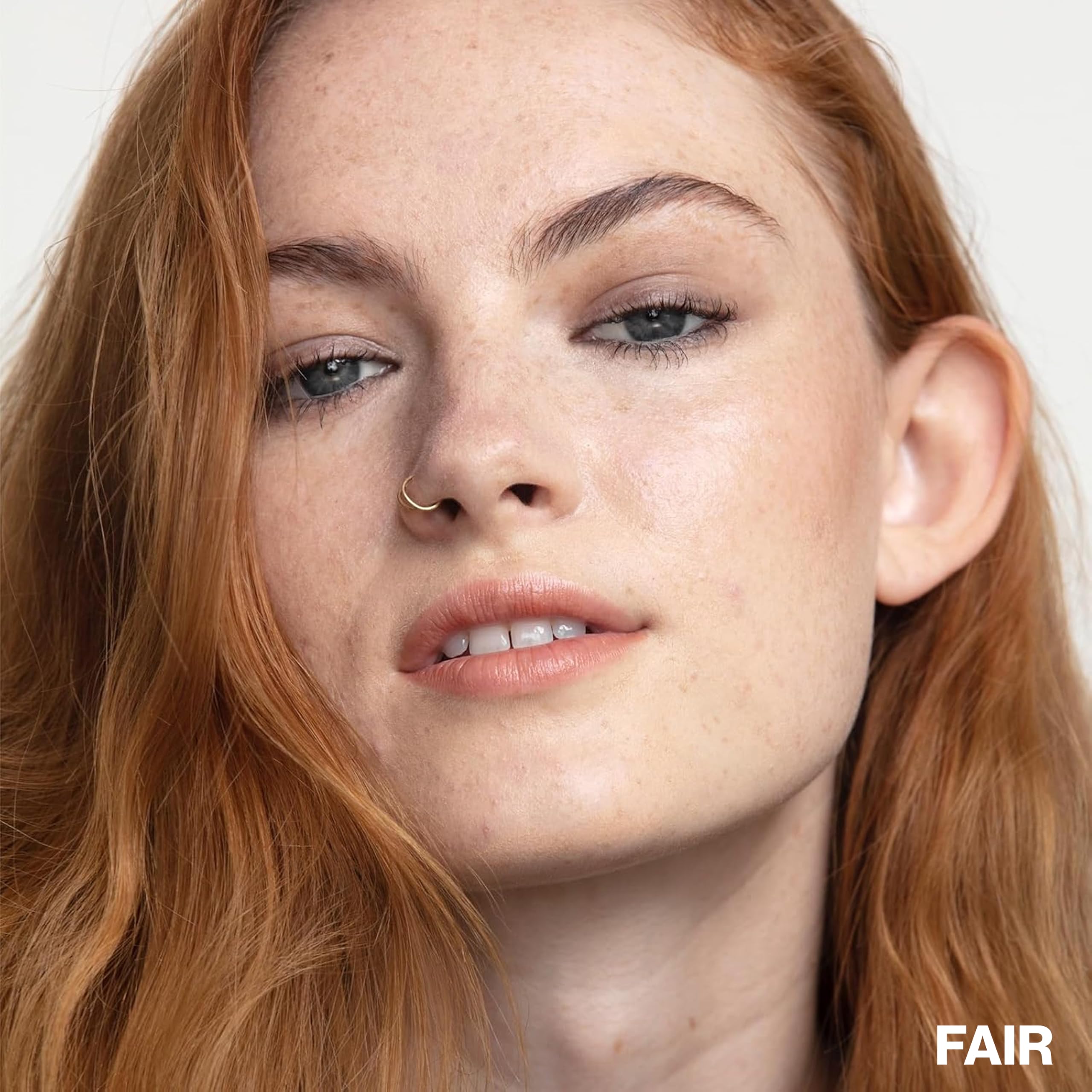 Smashbox lifestyle daylight use model wearing dewy tint for healthy glow
