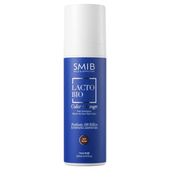 SMIB bottle front view shows product benefits and dark brown shade