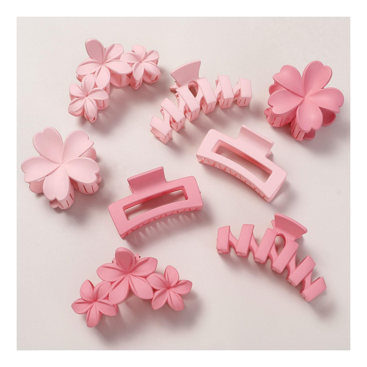 SMKSL front display of eight neutral flower claw clips showing variety and elegance