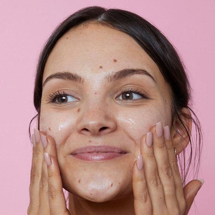 Close-up of biodegradable scrub beads in Soap & Glory cleanser, showing gentle exfoliation