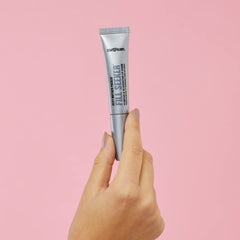Soap & Glory gloss held in hand for scale showing compact travel size benefit