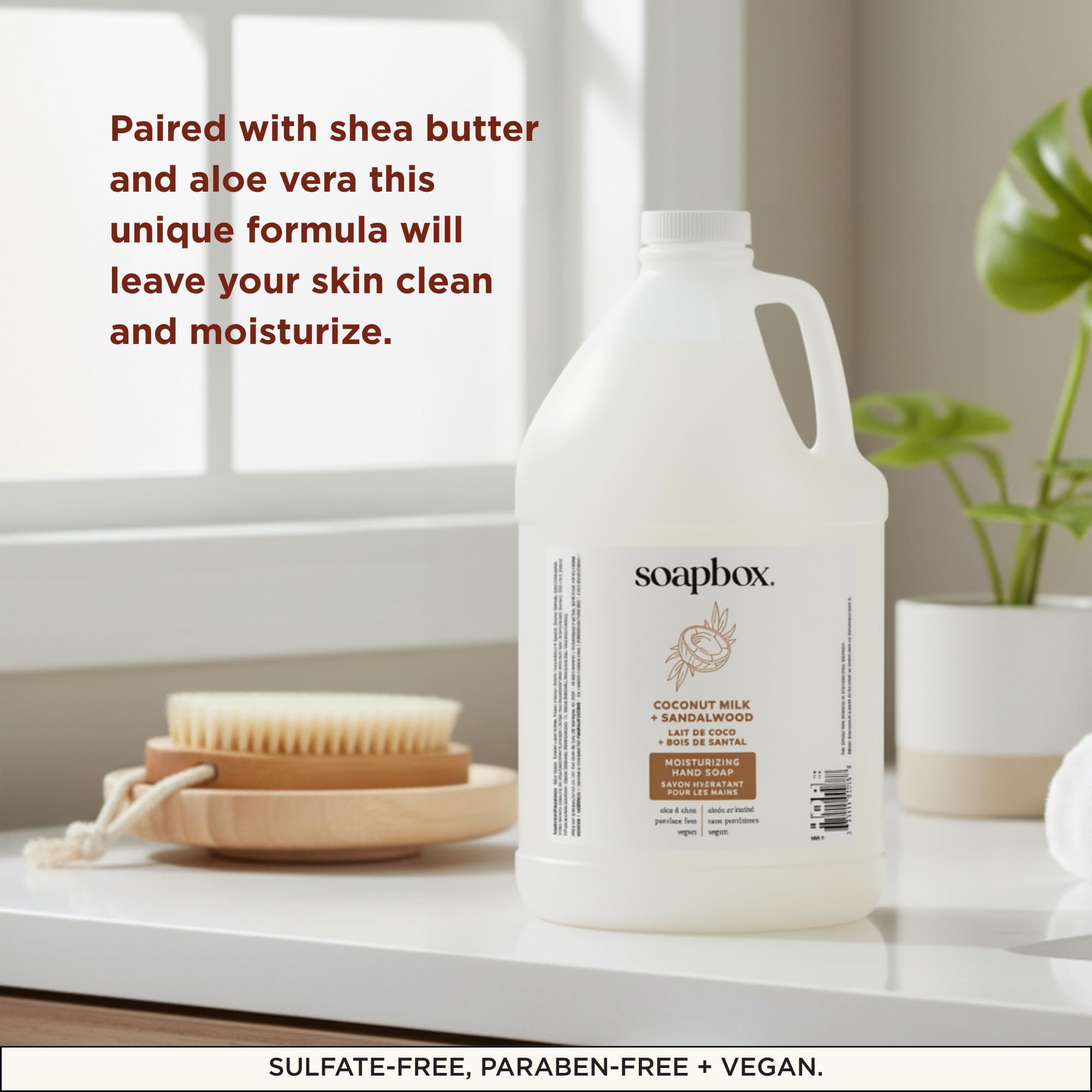 Soapbox gallon beside a hand for scale to show the 128oz supply