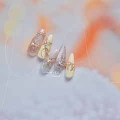 SOFTSOUL finished wedding manicure with butterfly decals adding elegant detail