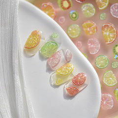 SOFTSOUL on-model summer nails showcasing vibrant fruit decals for vacation-ready style