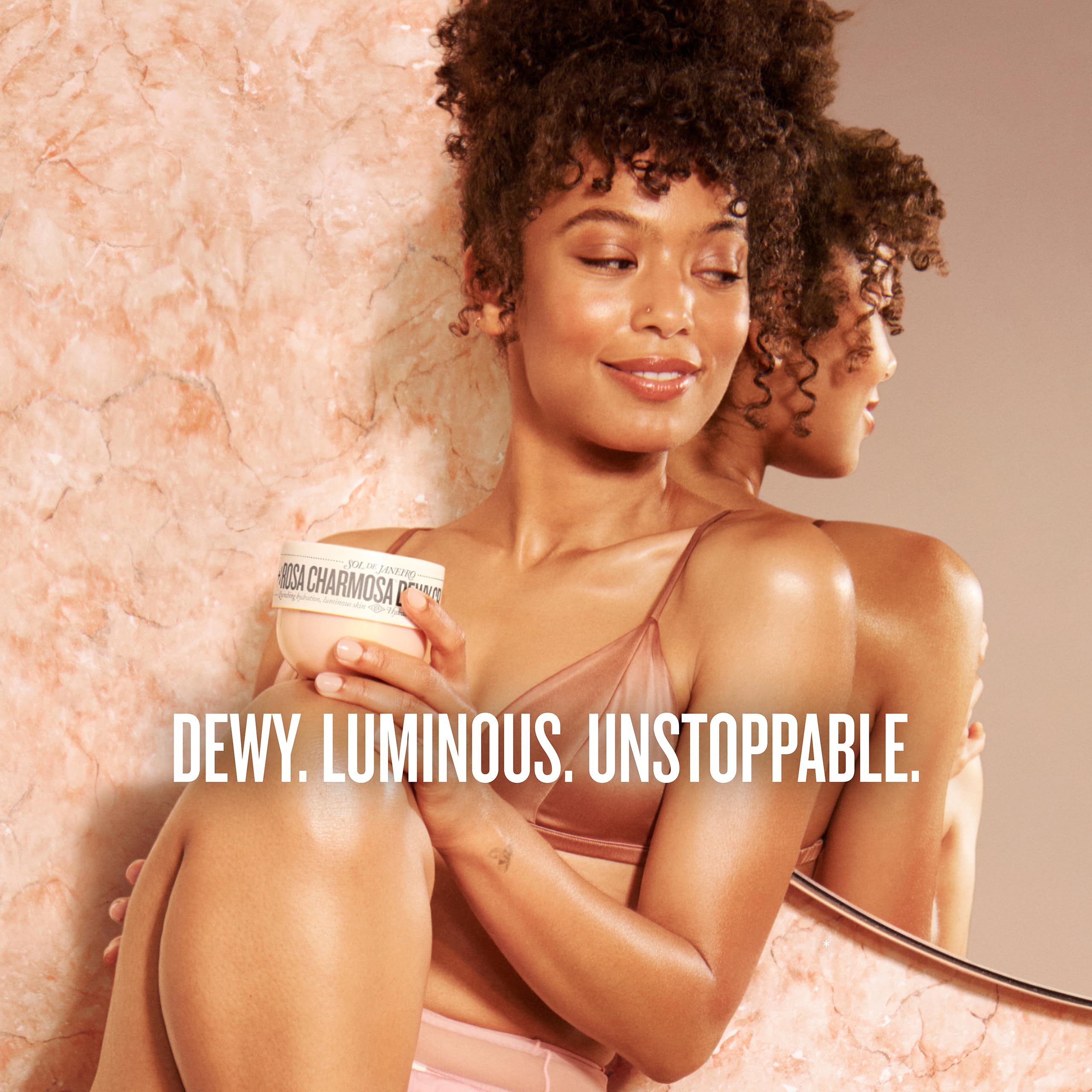 Sol de Janeiro mist spraying into air to refresh hair and body scent