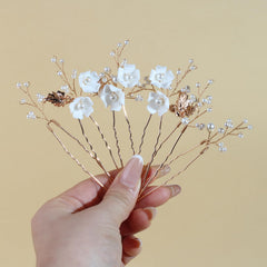 SOLENY close-up of white ceramic flower showing handcrafted detail and refined texture