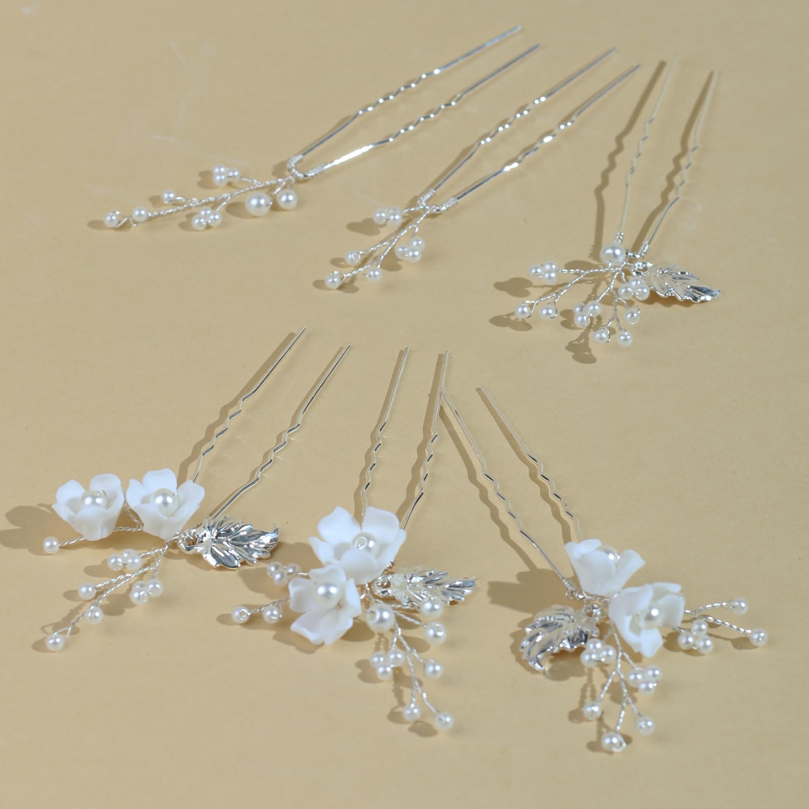 SOLENY pins artfully arranged on white fabric showing coordinated styling options advantage