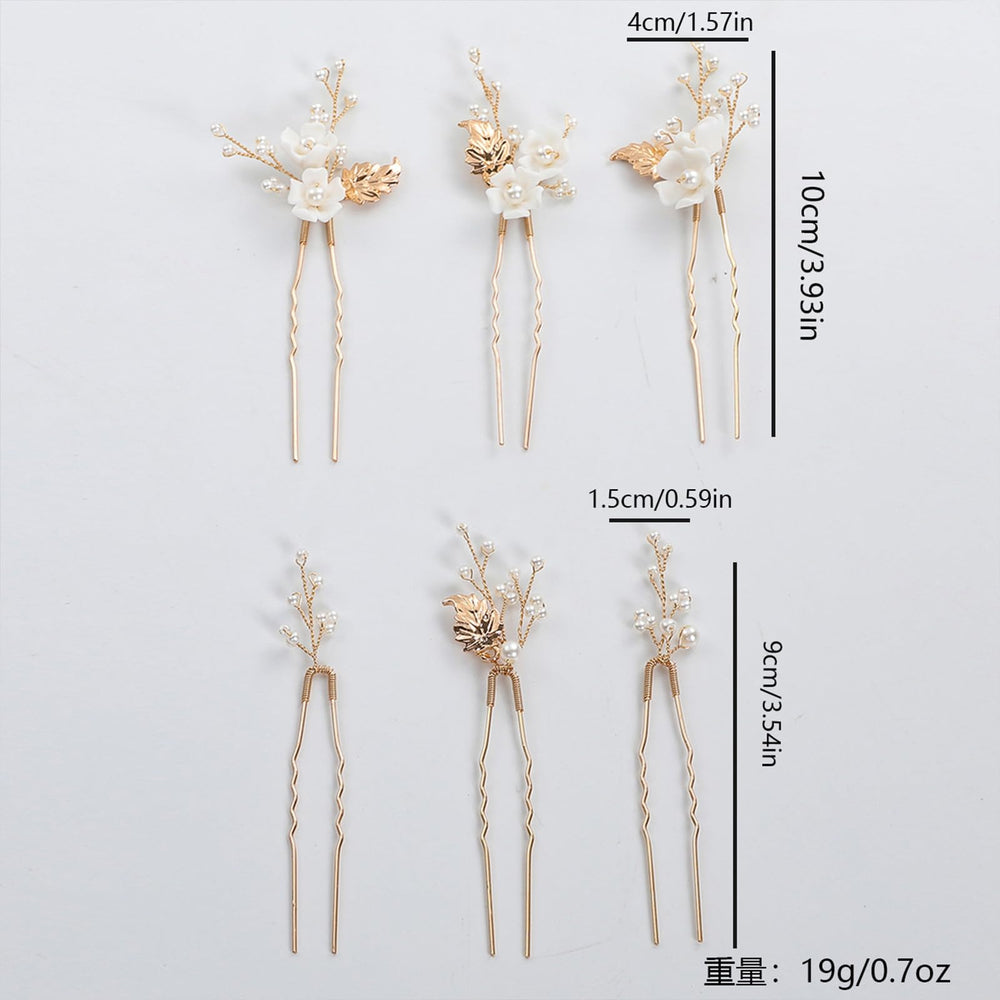 SOLENY pins held between fingers for scale showing lightweight size and easy placement