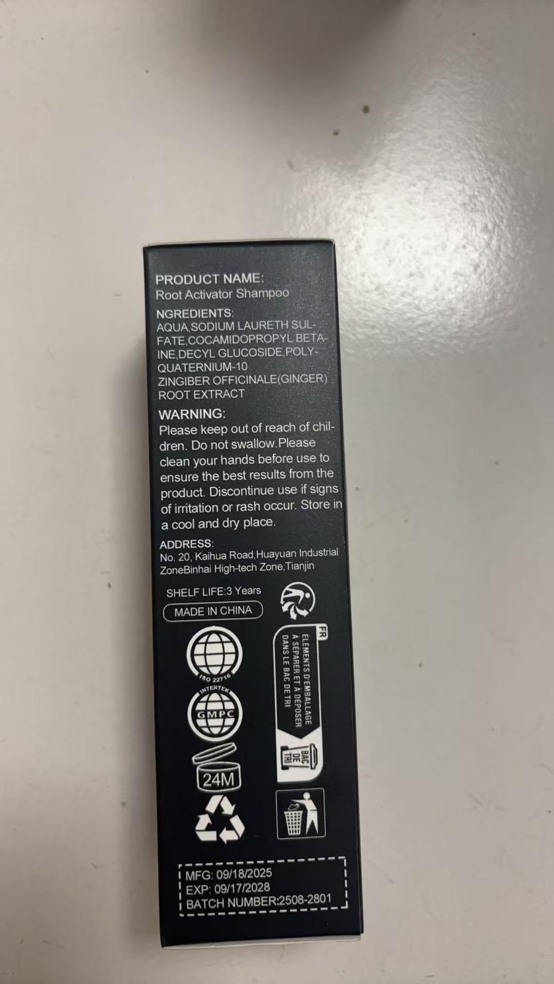 SPARTAN REPAIR SHAMPOO bottles on bathroom shelf showing travel-ready convenience