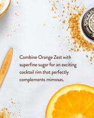 Spice Islands orange peel garnish on cocktail adding bright citrus aroma