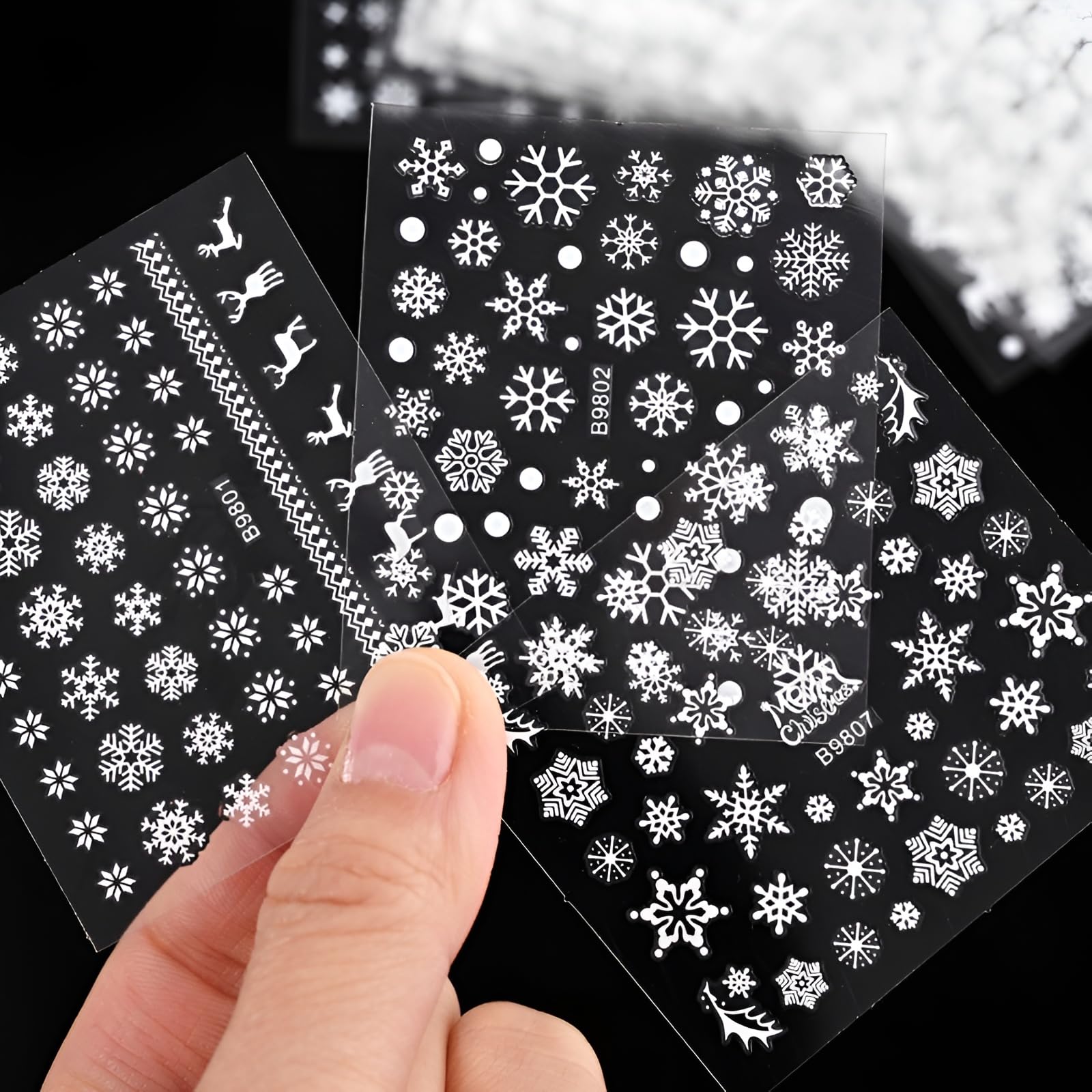 SPLOCUDU tweezers placing a decal on a nail showing precise application benefit
