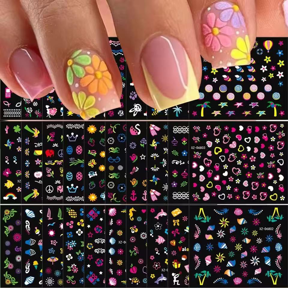 SPLOCUDU finished manicure on hands showcasing colorful designs