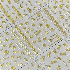 SPLOCUDU overhead view of multiple sheets displaying varied gold motifs