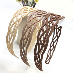 Springtime headband held in hand to show scale and ease of use for on-the-go styling
