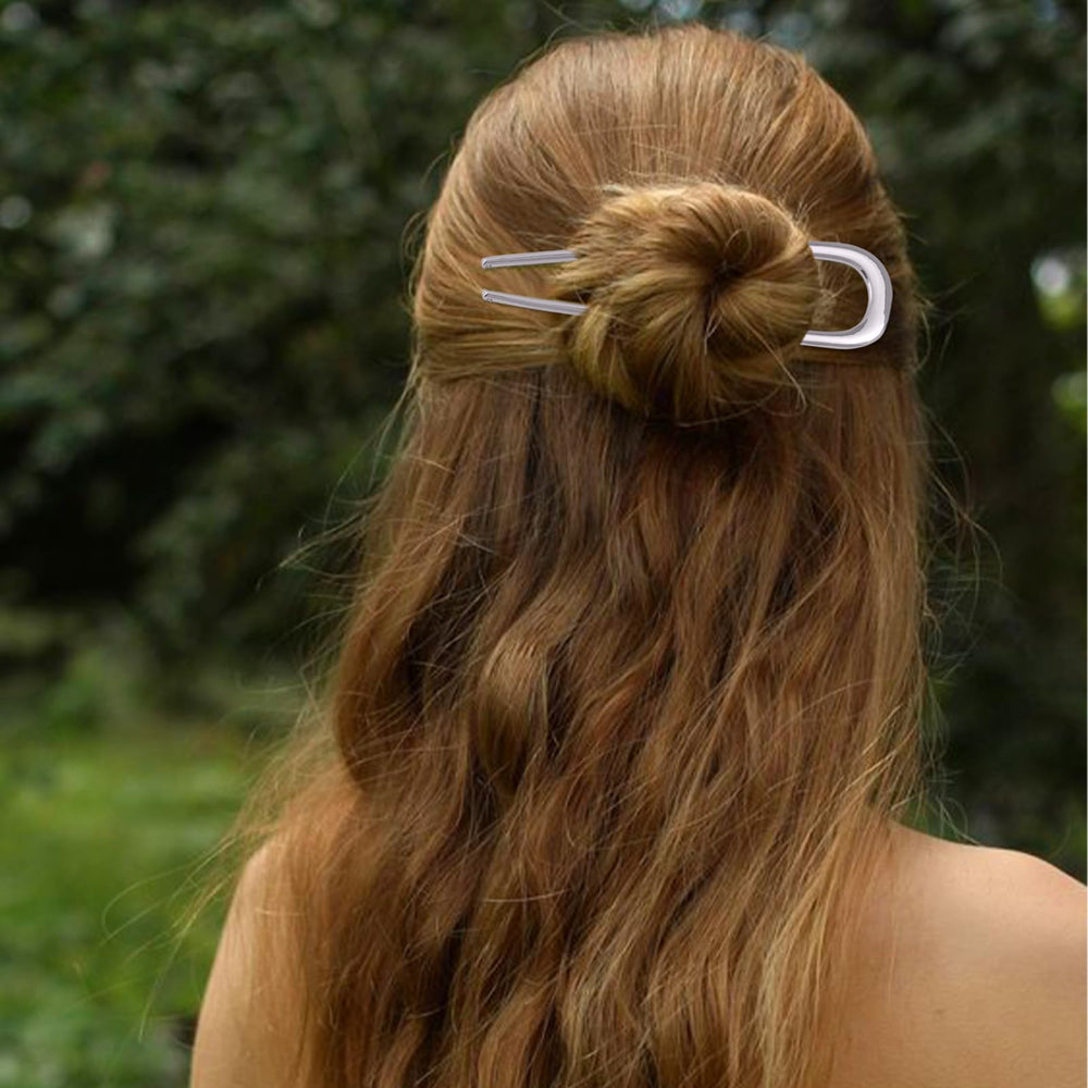 Srevela pin inserted in a neat bun showing stable updo benefit