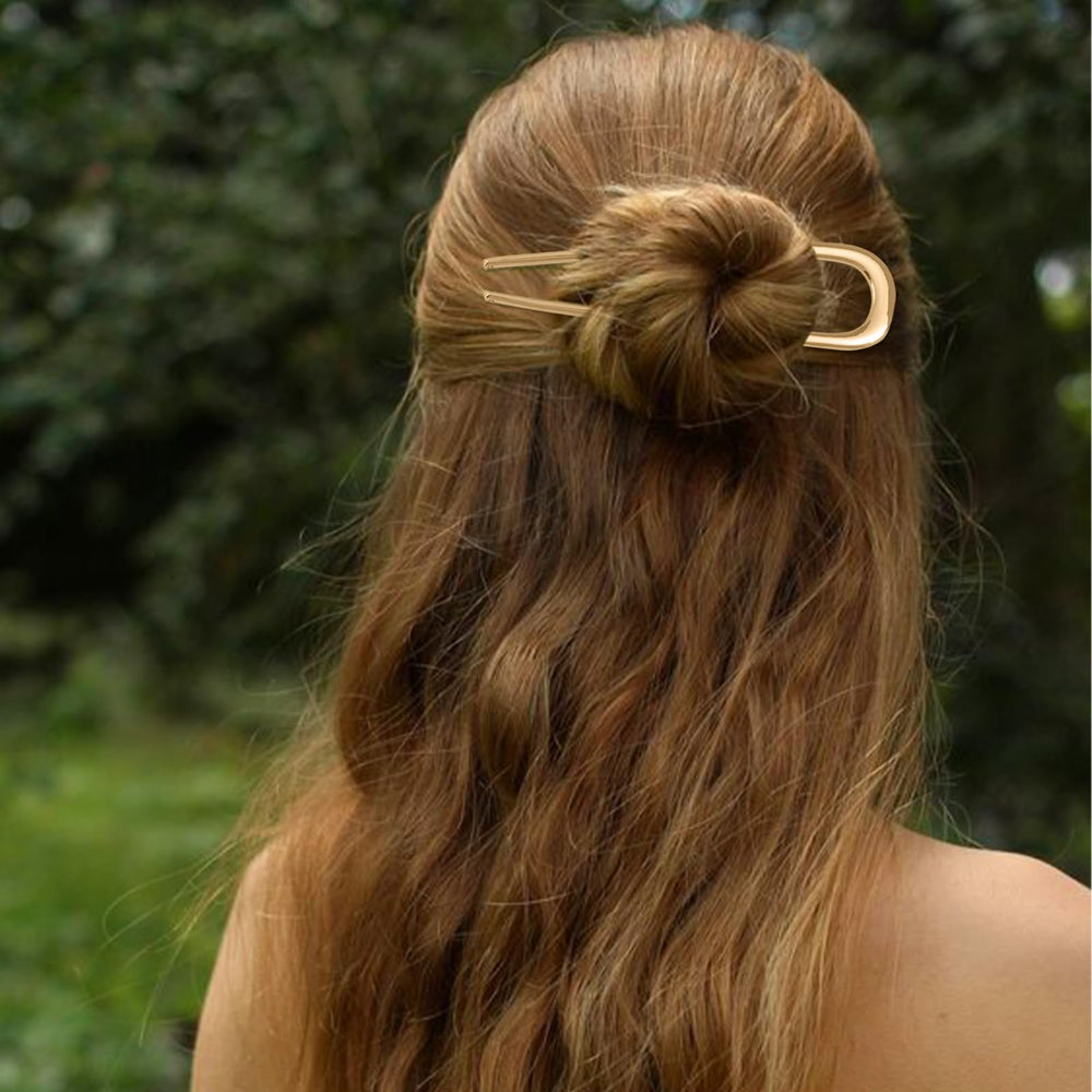 Srevela pins securing a messy bun for long hair, showing strong invisible support