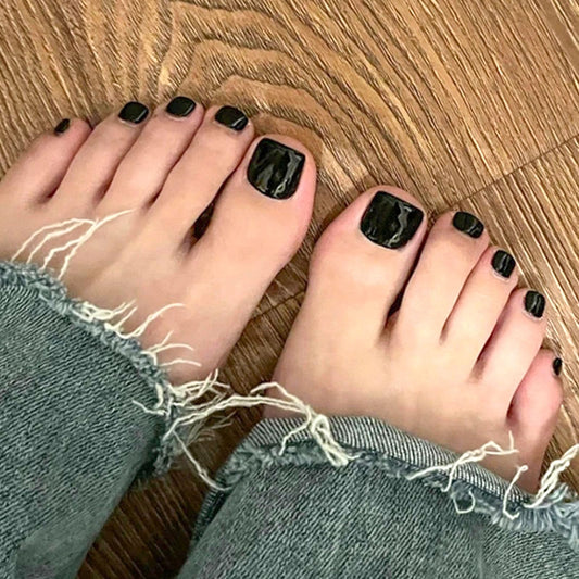 SRIMNUYY glossy black toe nail surface close-up highlighting shine and smooth finish