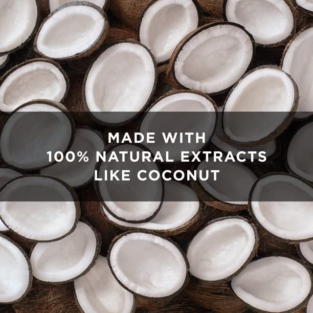 Coconuts and orchid flowers near St. Ives bottle highlighting natural extracts