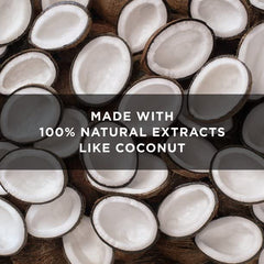 Coconuts and orchid flowers near St. Ives bottle highlighting natural extracts