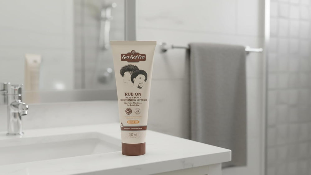 Sta-Sof-Fro being rubbed into scalp of braided hair to soothe dryness and add moisture
