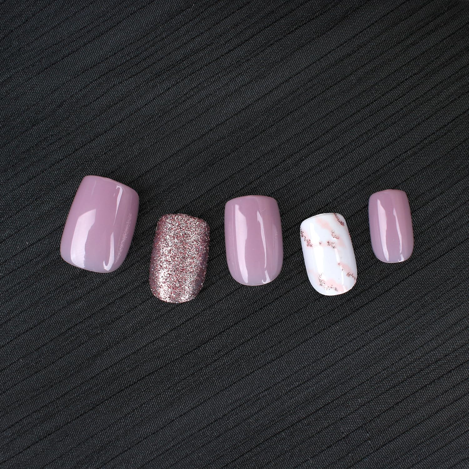 Stbisen close-up of marble and rose-gold glitter details, elegant accent visible