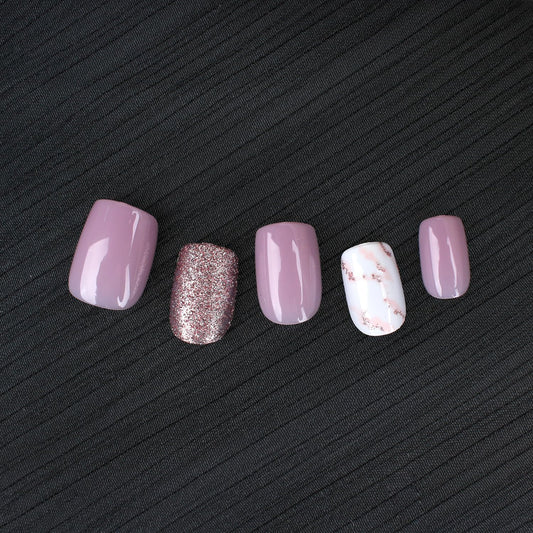 Stbisen close-up of marble and rose-gold glitter details, elegant accent visible