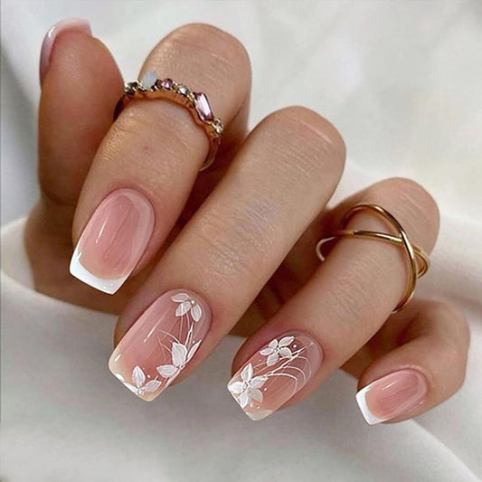Stbisen front packaging showing nude French press-on nails and kit benefits