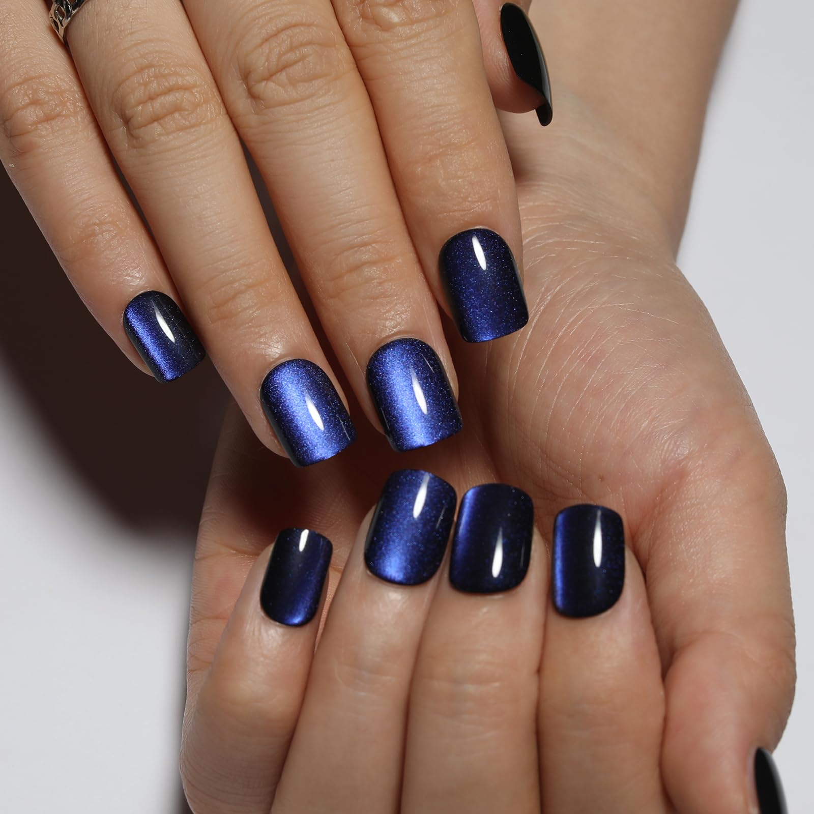 Stbisen nails in hand showing short square scale for practical wear