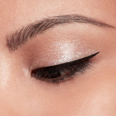 stila size and scale next to fingertip displaying compact wand for effortless control