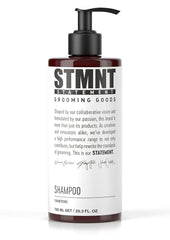 STMNT shampoo front bottle showing label and size, clear branding and benefit