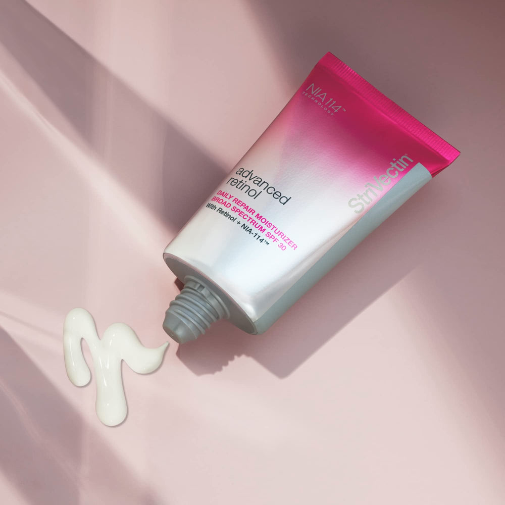 StriVectin moisturizer on hand for size scale and travel-friendly portability