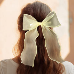 STSTR bow worn outdoors showing cheerful color benefit: bright seasonal accent