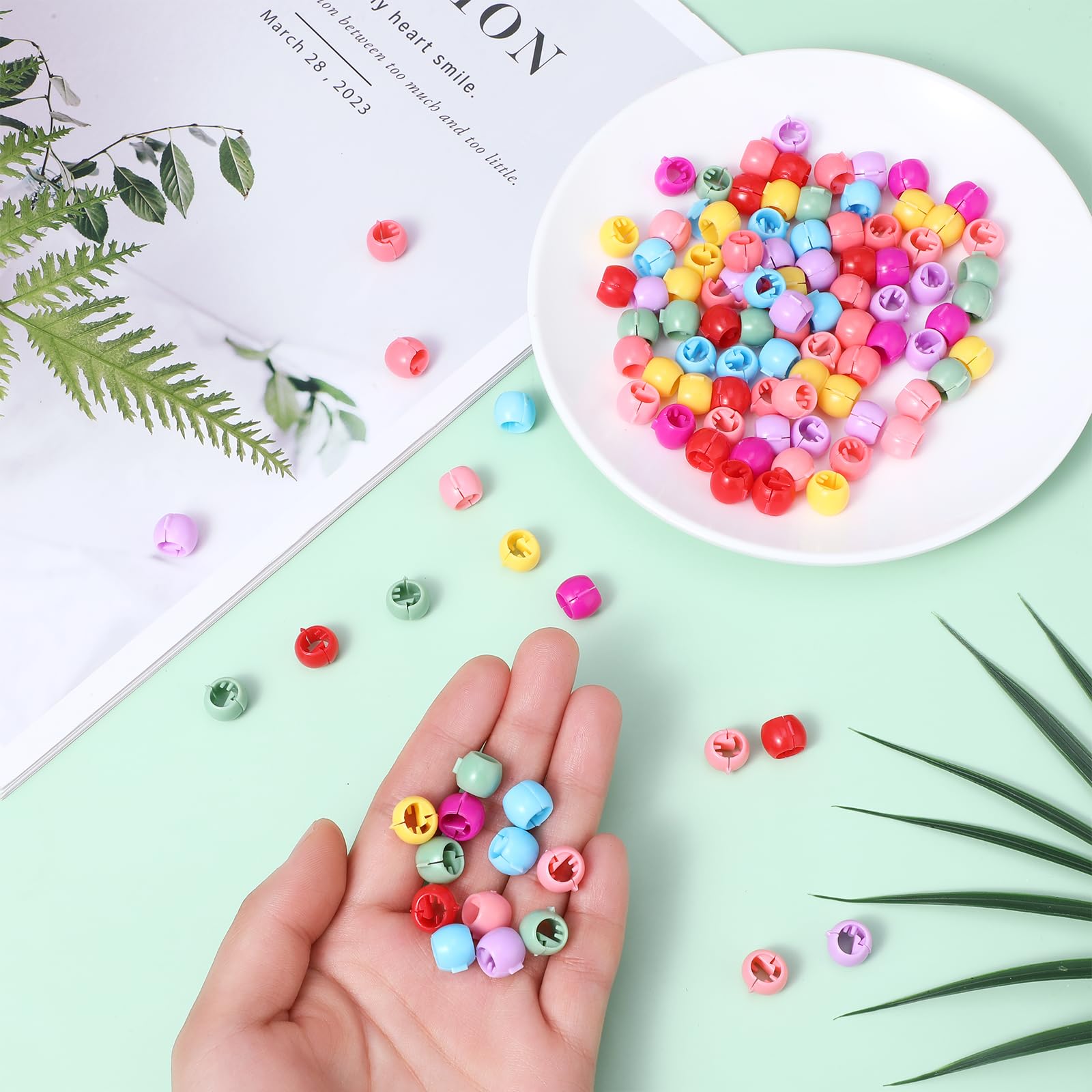 Styquenzer bead opened to reveal snap mechanism that secures hair gently