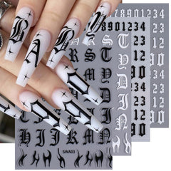STZPRONAIL lifestyle hands with initial nail art showcasing personalized manicure inspiration