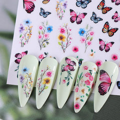 STZPRONAIL stickers on fingers showing size and scale for planning nail layouts benefit