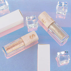 SUAKE makeup flatlay in a bag illustrating travel-ready shimmer for quick touch-ups