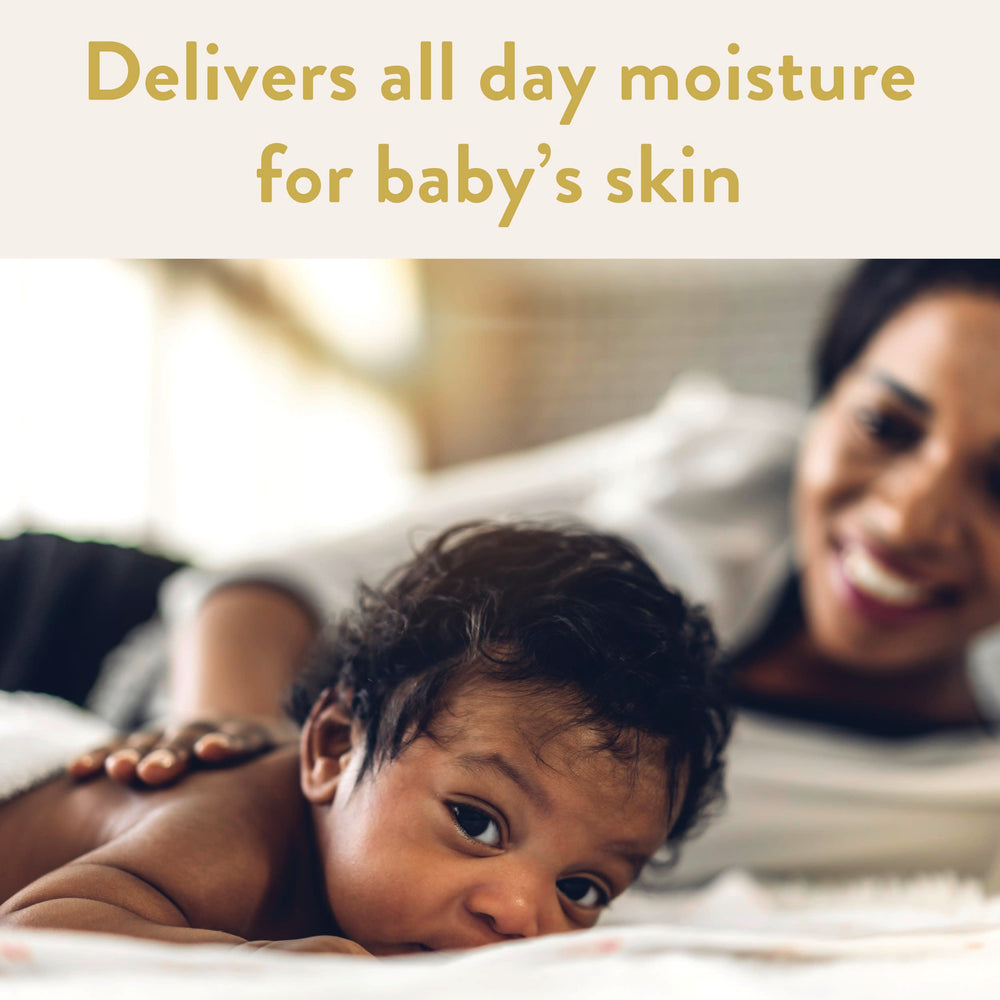 Suave baby detangler being applied to damp curls for easier combing