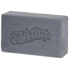 Suavecito bar held next to hand for scale, illustrates generous 6 oz size