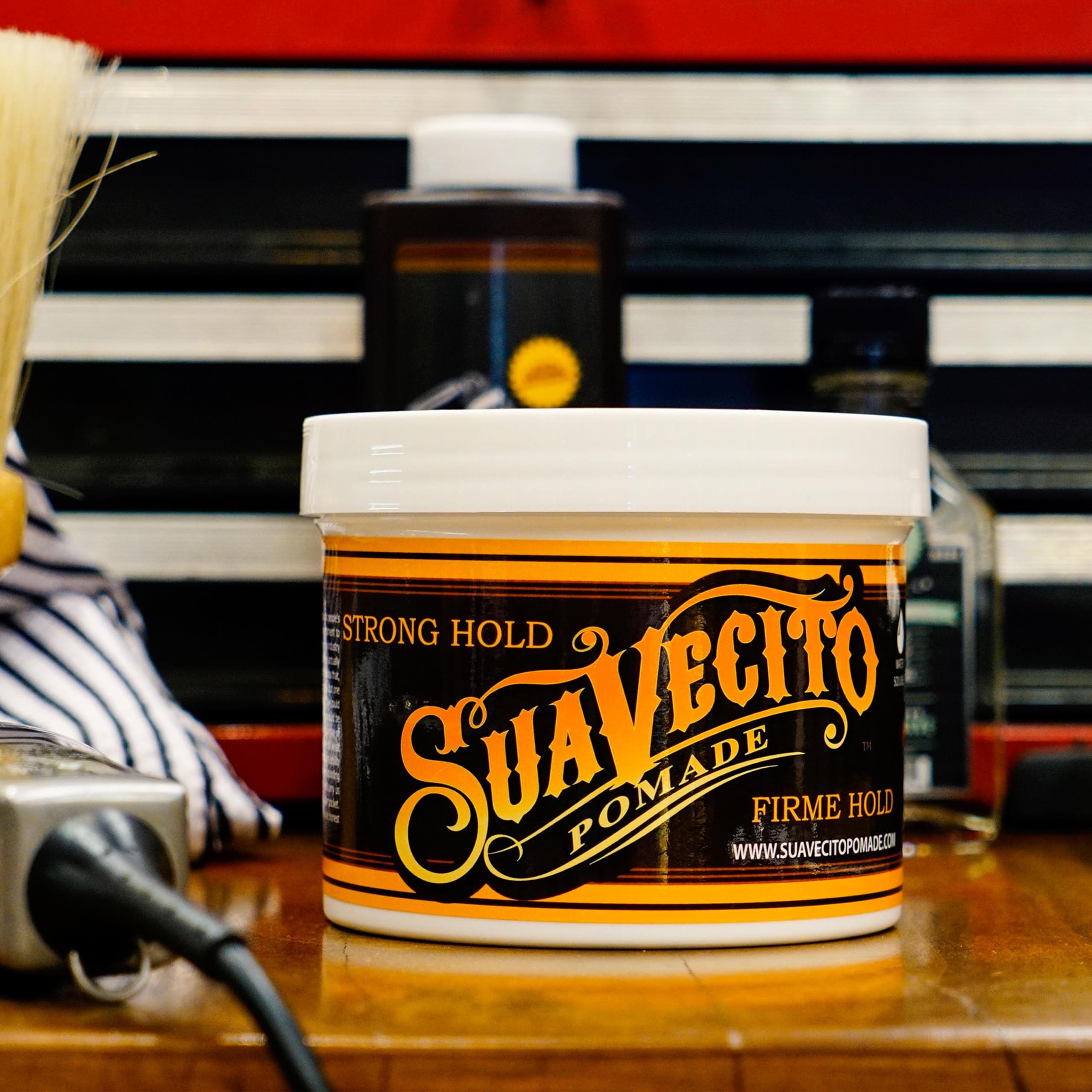 Suavecito tub on barber counter showing bulk size for professional use benefit