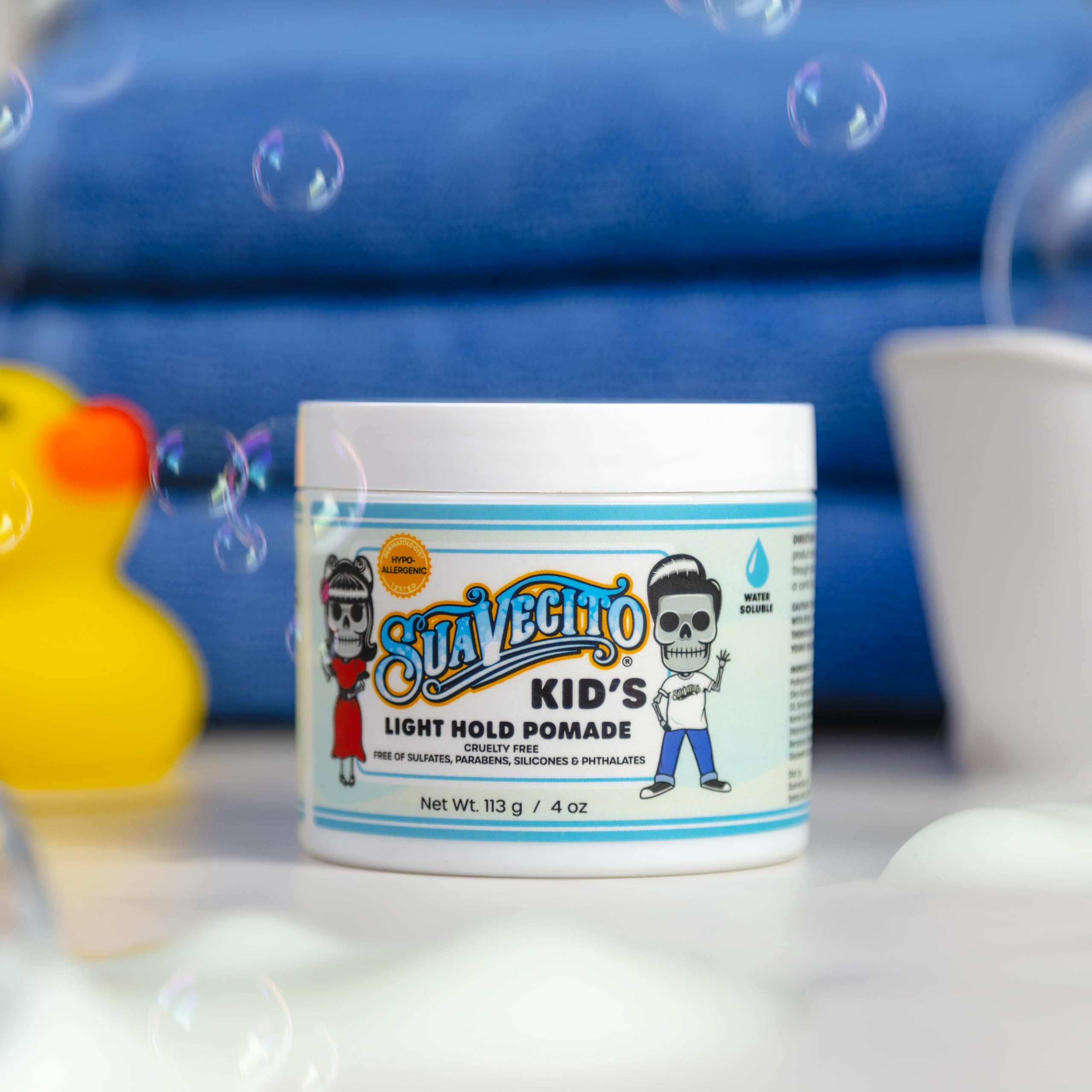 Smiling child styled with Suavecito showcasing natural, soft hair