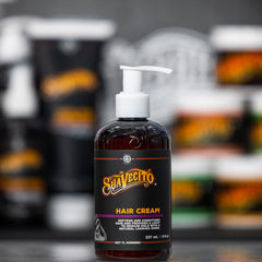 Suavecito in barbershop setting styled hair with classic masculine scent vibe