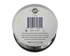 Suavecito tin tucked in a travel bag showing portability and on-the-go grooming benefit