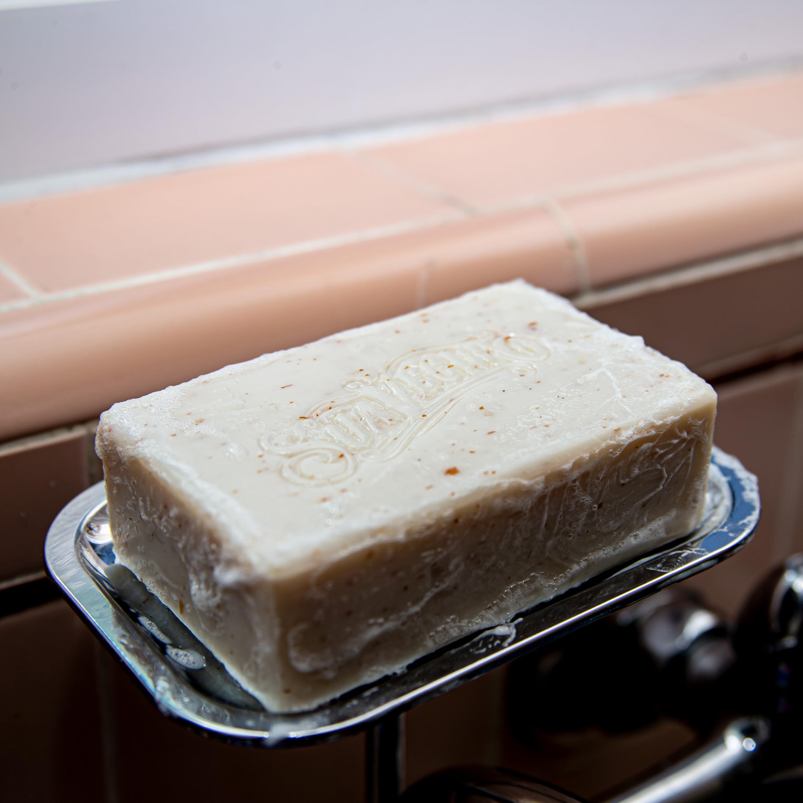 Suavecito Whiskey Bar displayed in bathroom setting conveying masculine scent and grooming appeal